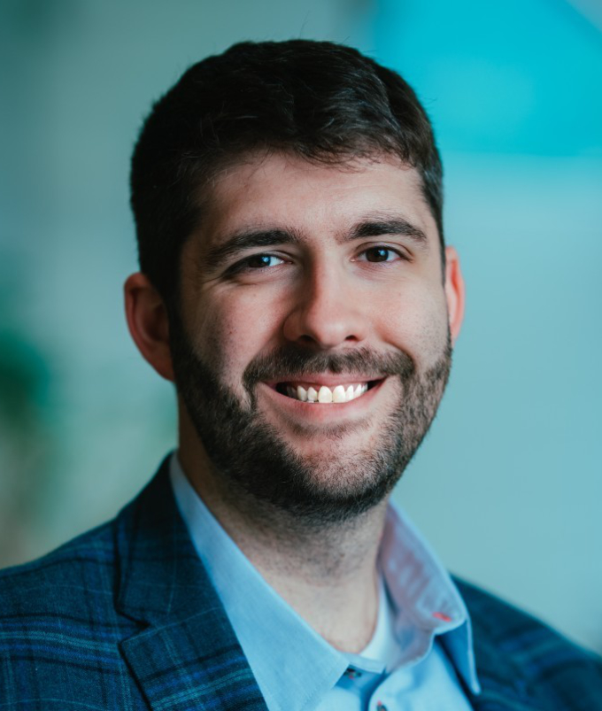 A portrait of Dominic Romito, the Chief Growth Officer of Regola Cyber.